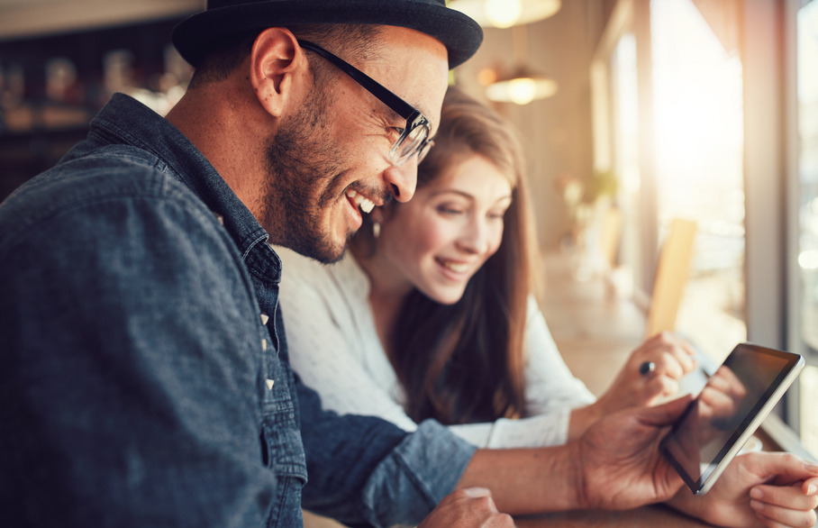 Two people looking at a phone screen