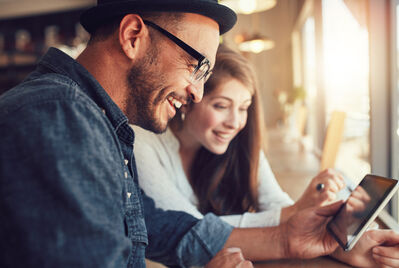 Two people looking at a phone screen