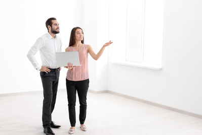 Real estate agent showing apartment to client