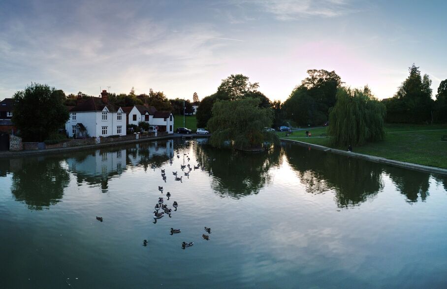 A house in front of a lake