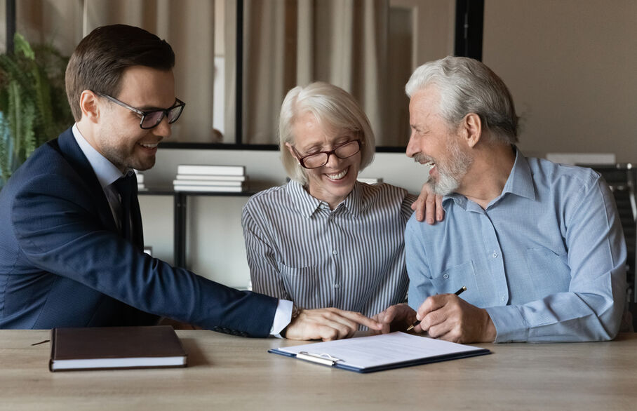 An older couple having a meeting with an estate agent