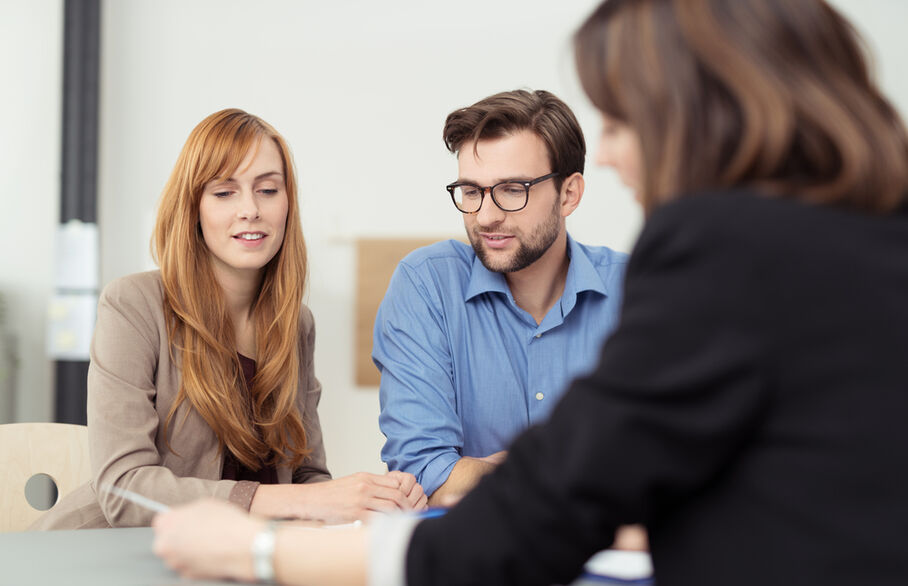 Three people having a meeting