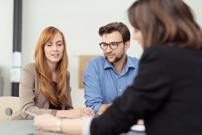 Three people having a meeting