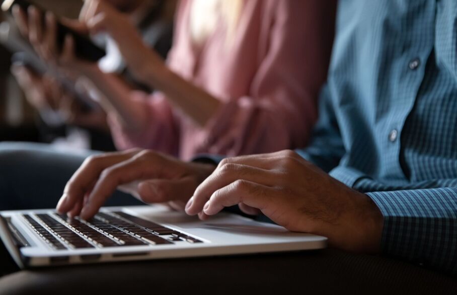 Someone typing on a keyboard