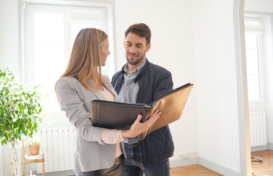 An estate agent showing someone a house