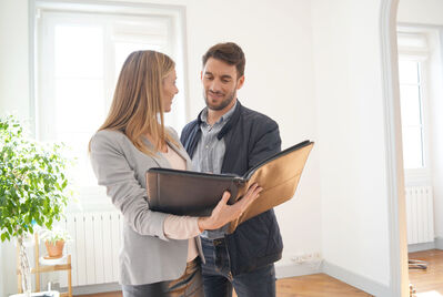 An estate agent showing someone a house