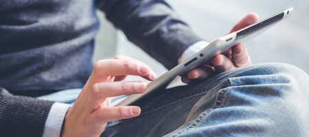 Man looking at tablet