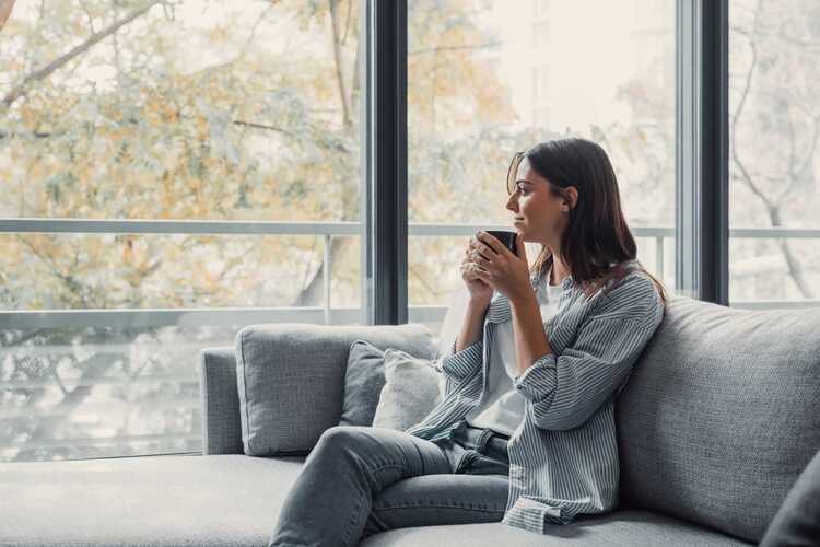 A woman sitting on a sofa