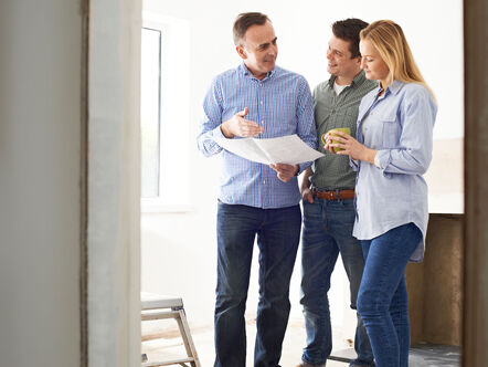 Couple being shown around a property 