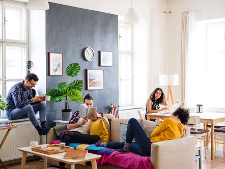 Friends relaxing in living area