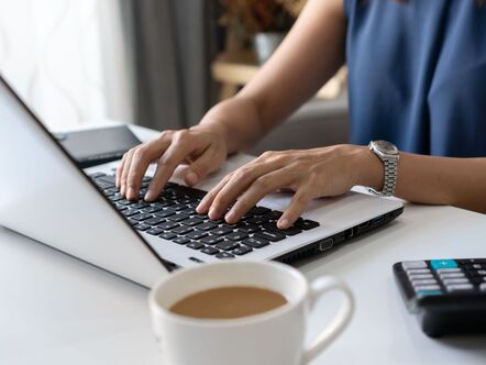 Person typing on a laptop