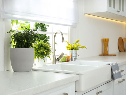 Beautiful white sink near window in modern kitchen